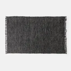 Tappeto 180x120 cm in cotone nero con effetto a spina di pesce