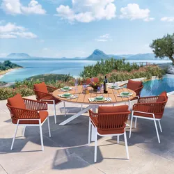 Set pranzo tavolo rotondo 180 cm top effetto legno e 6 sedie in alluminio e corda rosso mattone - Clerc