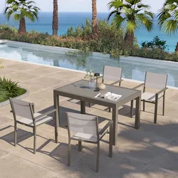 Set pranzo tortora con tavolo 135/270x90 cm top vetro e 4 sedie con braccioli textilene e alluminio - Carioca