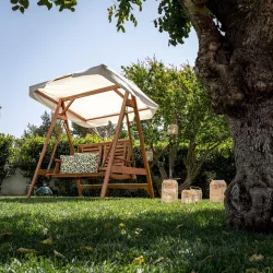 Dondolo da giardino in legno di acacia con tettuccio in tessuto - Paja